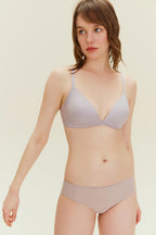Front view of model wearing light purple bra and matching briefs.