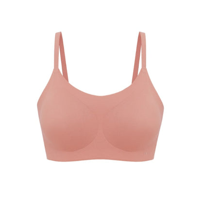 Flat lay of spaghetti strap bra in coral