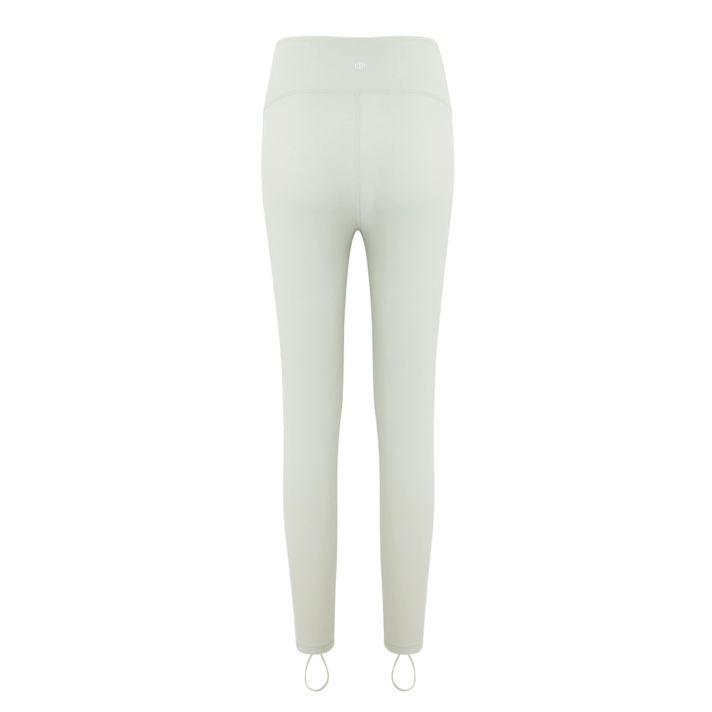 flat lay image of cream leggings from back