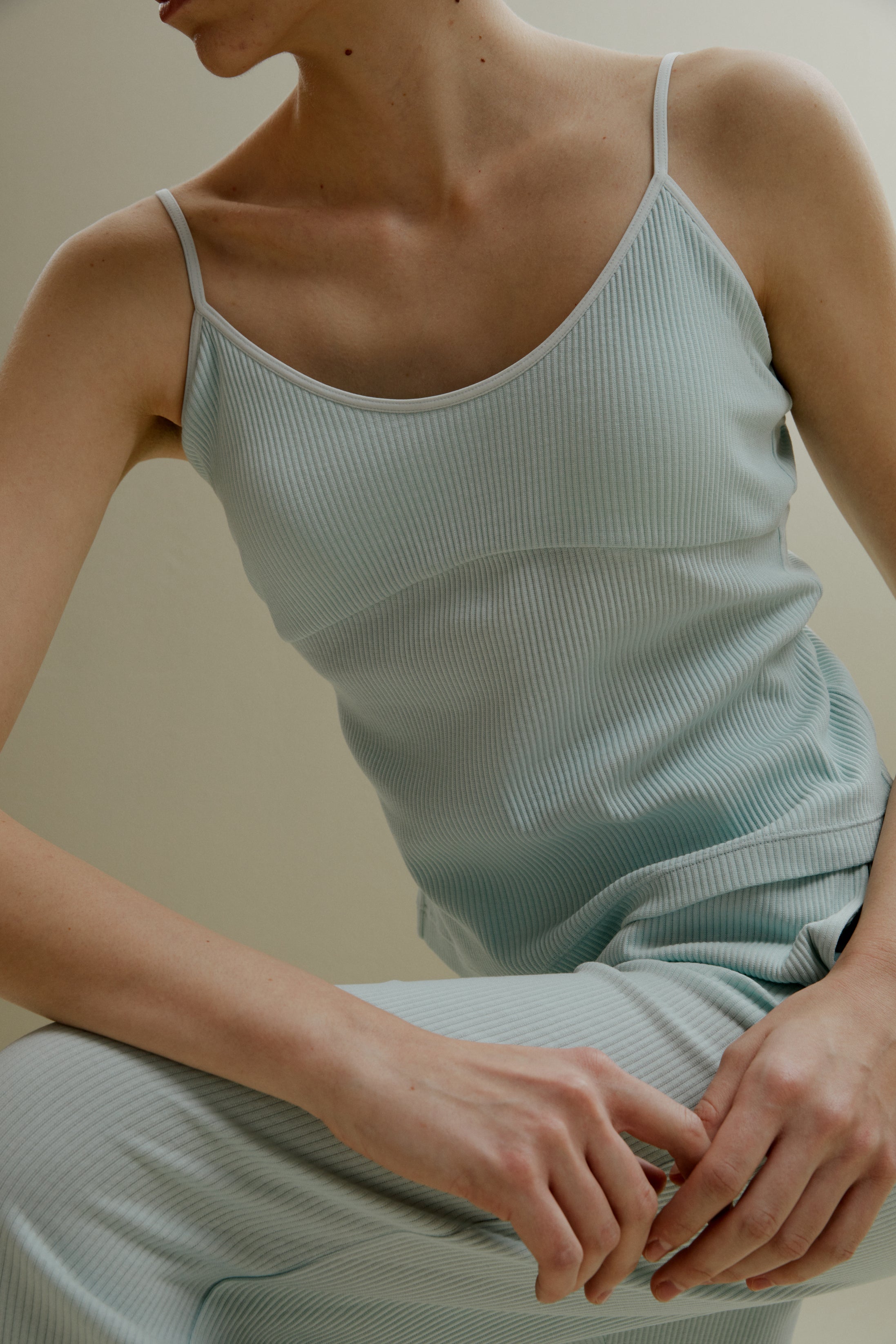 women in pale blue U-neck padded camisole