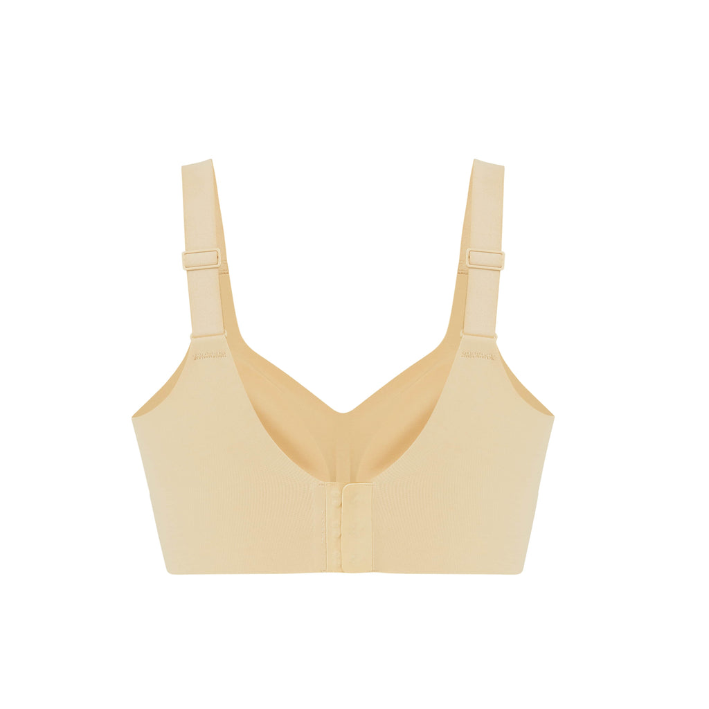 flat lay of the back of light yellow bra with clasps