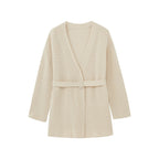 flat lay image of cream cardigan