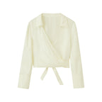 flat lay image of white satin shirt