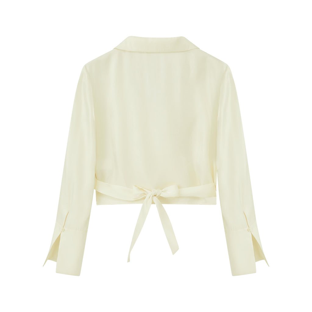 flat lay image of navy satin shirt from back