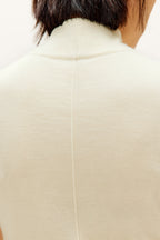 white silky wool mock neck sleeveless sweater from back